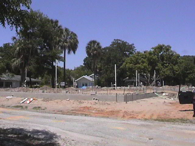 Footings, stem walls, utilities, fill, and slabs for the two Rinoldo houses.