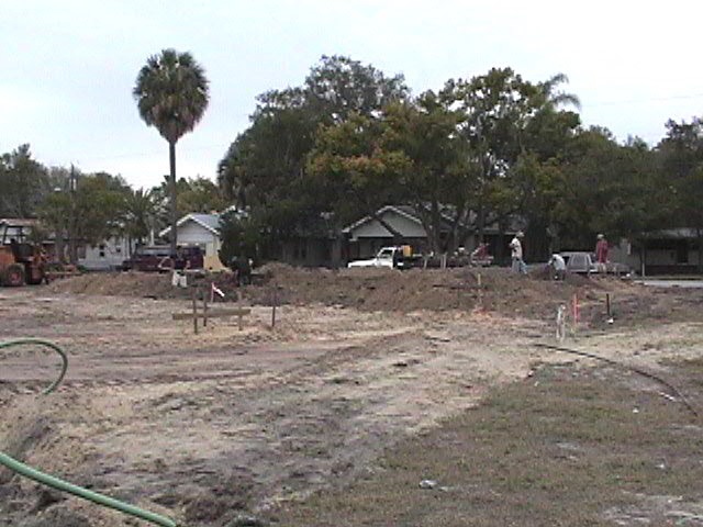 Footings, stem walls, utilities, fill, and slabs for the two Rinoldo houses.