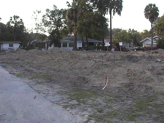 Footings, stem walls, utilities, fill, and slabs for the two Rinoldo houses.