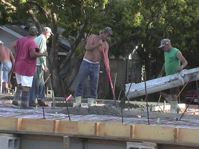 Footings, stem walls, utilities, fill, and slabs for the two Rinoldo houses.