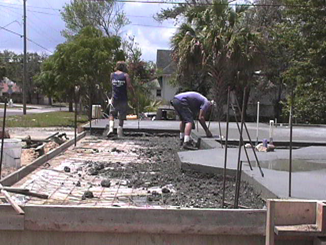Footings, stem walls, utilities, fill, and slabs for the two Rinoldo houses.