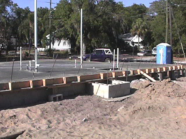 Footings, stem walls, utilities, fill, and slabs for the two Rinoldo houses.