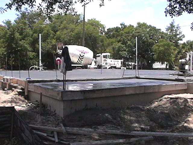 Footings, stem walls, utilities, fill, and slabs for the two Rinoldo houses.