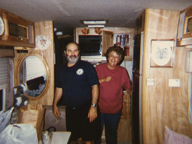 Tom and Helen Rinoldo standing in the kitchen of their RV at Toad Suck Park in July 1996.